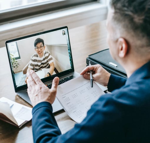 Men using Meet on computer