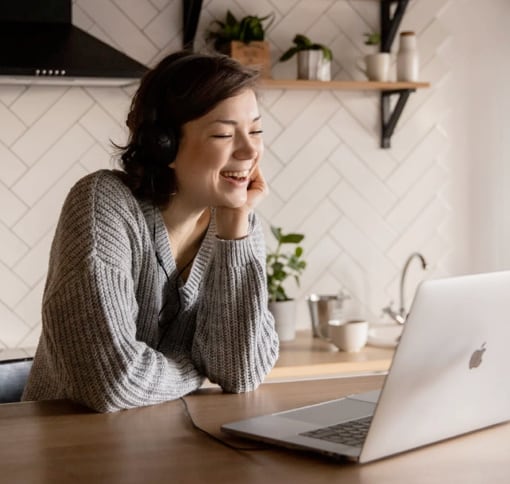 Woman using Meet on computer