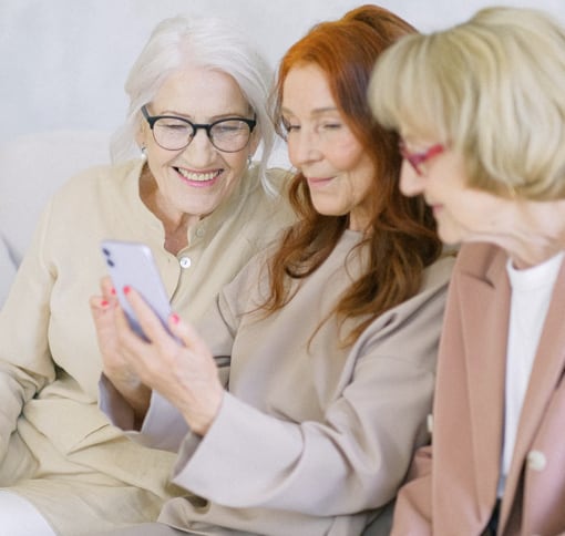 Group of women using Meet on cellphone